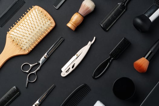 Variety of Hair Styling Tools and Accessories Displayed on a Dark Background photo