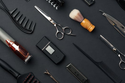 Variety of Hair Styling Tools and Accessories Displayed on a Dark Background photo