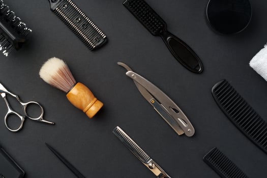 Variety of Hair Styling Tools and Accessories Displayed on a Dark Background photo