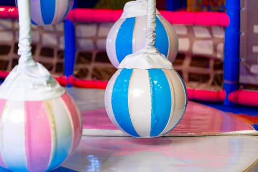 Colorful Inflatable Punching Bags in a Brightly Lit Indoor Play Area photo