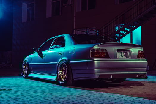 Silver Car Parked in Front of Building photo