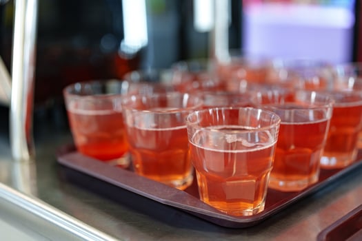 Colorful Array of Fruit Juice Cups on a Serving Cart in a Cafeteria photo