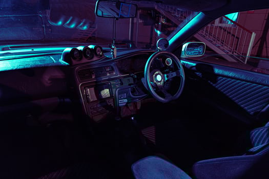 The Interior of a Car With Blue Lights photo
