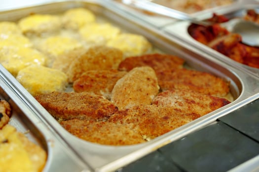 Variety of Food Displayed on Buffet Table photo