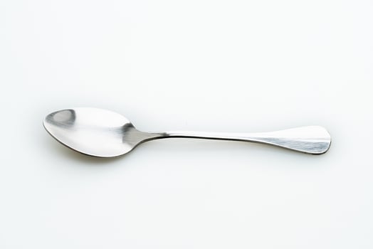 silver spoon on white background photo