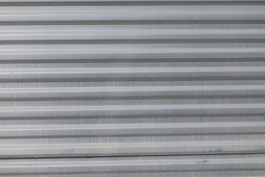 Ribbed texture. Wall with horizontal lines. photo
