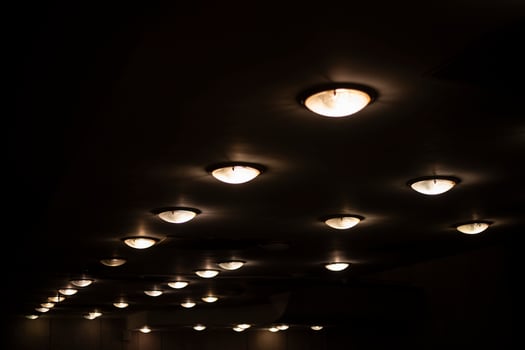 Round lamps on the ceiling. Lots of lamps in a row. Ceiling in the Great Hall. photo