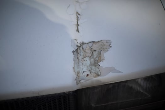 Damage to the hood. A dent in the car. Damaged transport. photo