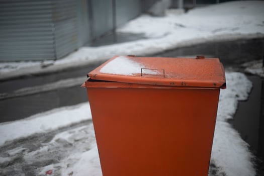Orange sand tank for road. Orange Steel Tank. Emergency sand storage location. photo