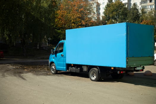 Blue Truck on Uliitsa. Blue Vehicle Bodywork. Transportation of goods. photo