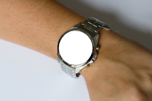 Stylish silver wristwatch with mockup close-up on hand photo