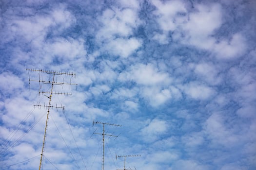 Electric Poles Against And Background Blue Sky photo