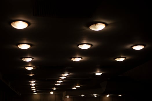 Round lamps on the ceiling. Lots of lamps in a row. Ceiling in the Great Hall. photo