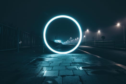 Glowing neon circle illuminating empty street at night photo