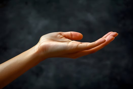 Open Hand Gesture Against Dark Background - Concept of Giving and Receiving photo
