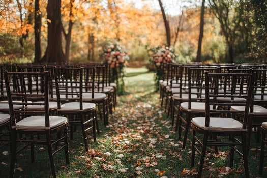 Wedding ceremony chairs standing on grass with autumn leaves photo