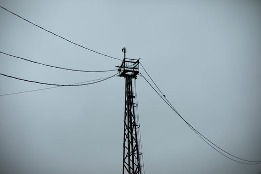 Tower with wires. Tower on the background of the sky. High Steel Tower. photo