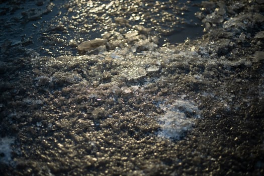 Frozen ground. Ice on the road. Frozen surface. photo