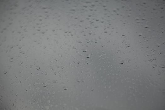 Wet glass. Raindrops on window. It's rainy day. photo