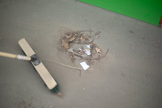 Cleaning up trash on the street. Scoop with fire. Broom for sweeping. photo