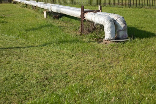 Heating pipes in the city. Outdoor heating system. Details of the industrial facility. photo