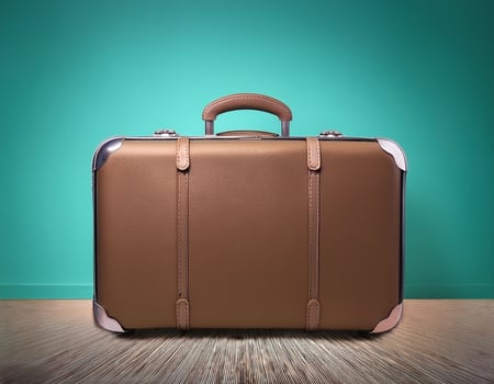 Classic suitcase isolated on minimalist background photo