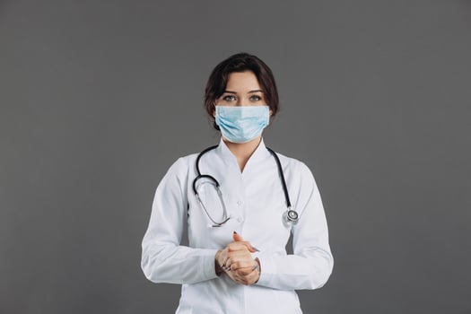 Coronavirus in Europe. Novel coronavirus 2019-nCoV, woman doctor in blue medical face mask. Concept of covid-19 quarantine. Attention photo
