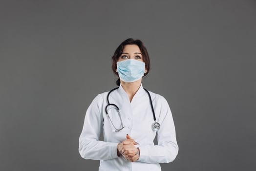 Coronavirus in Europe. Novel coronavirus 2019-nCoV, woman doctor in blue medical face mask. Concept of covid-19 quarantine. Attention photo