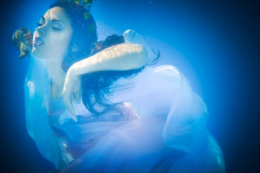 Underwater close up portrait of a woman photo