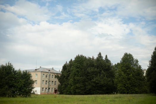House in the park. Park in the city. The building is in a green area. photo