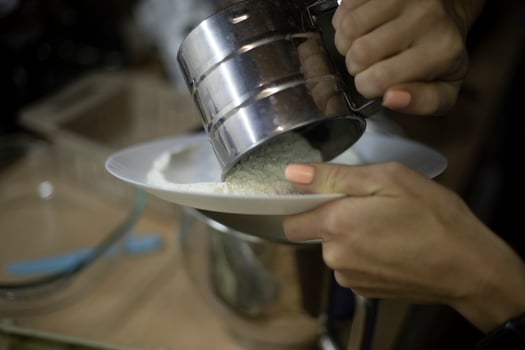 Sifting flour. Baking. Meal preparation details. photo