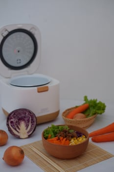 Salad with carrot, corn and lettuce in a clay bowl. photo