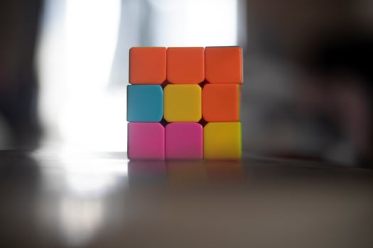 Intellectual game. Cube made of different colored tiles. A game for the mind. photo
