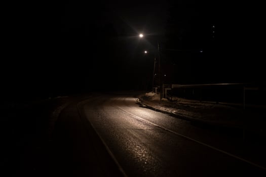 Empty road at night. Highway outside the city in the dark. Light on the road. photo