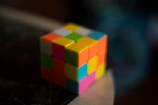 Intellectual game. Cube made of different colored tiles. A game for the mind. photo