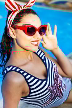 Beautiful pin up girl near the swimming pool photo