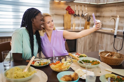 Friends sharing a joyful dinner and making memories photo