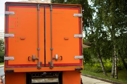 Orange truck body. Orange doors in car. Door to body. Cargo transport. photo
