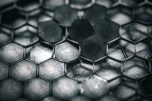 Small pentagons, parts laser cut in metal, close up photo