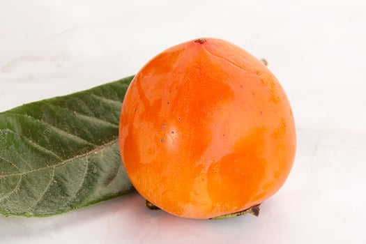 Fresh ripe sweet juicy persimmon photo