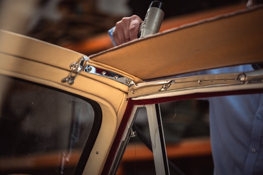 Classic car interior restoration process in a garage photo
