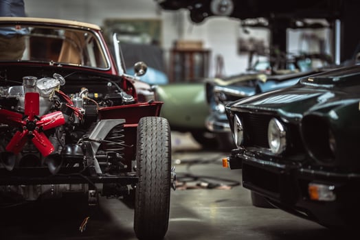 Classic cars being restored in a vintage vehicle garage workshop photo
