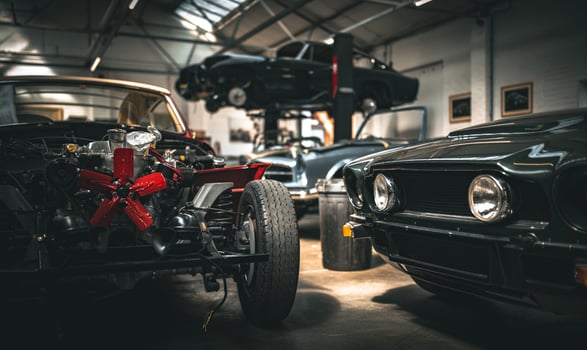 Classic cars being restored in a vintage vehicle garage workshop photo
