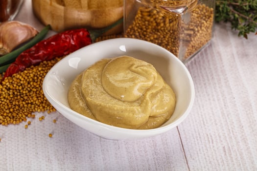 Dijon mustard sauce in the bowl photo