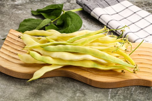 Raw green bean strings heap photo
