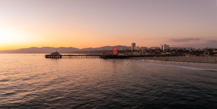 Aerial View of Santa Monica Pier and Ferris Wheel at Sunset photo