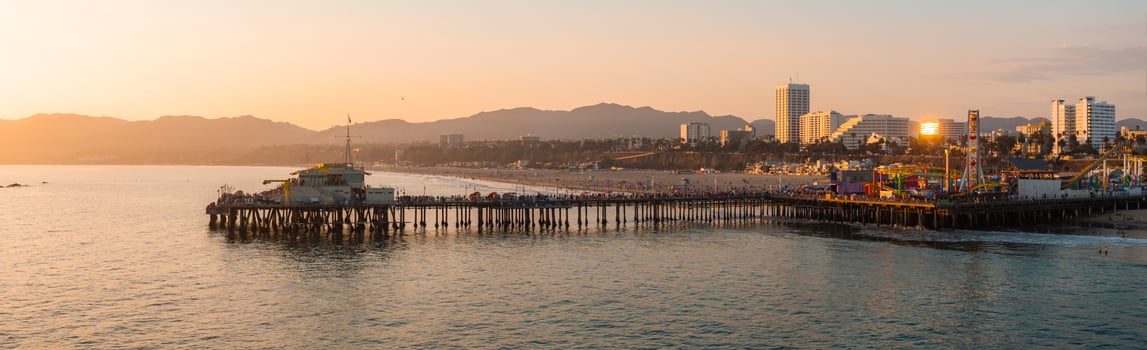 Panoramic View of Santa Monica Pier at Sunset with Cityscape photo