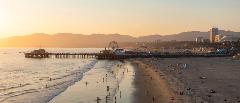 Santa Monica Pier at Sunset with Ferris Wheel and Cityscape photo