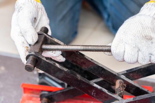 Repair scissors jack or motorcycle lift tables in garage,The scissor jack threads were broken, photo
