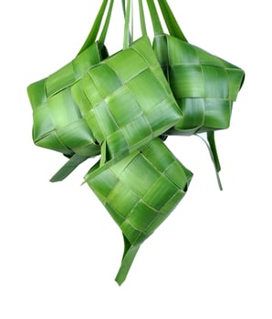 Ketupat is a traditional Indonesian food with rice wrapped in coconut leaves photo
